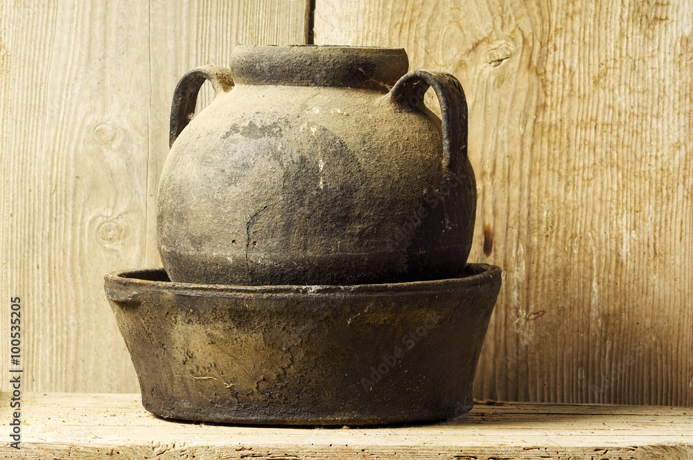 antique ceramic vase with handles with wooden background antique ceramic vase with handles with wooden background