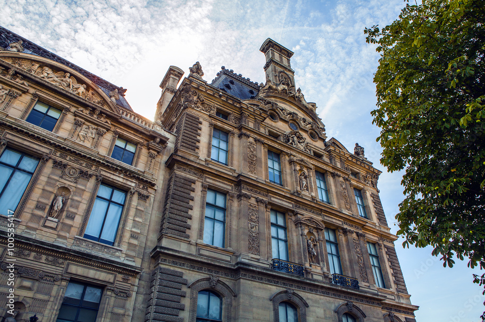 PARIS, FRANCE - 02 SEPTEMBER, 2015: Building of Louvre in Paris, France.The museum is one of the world's largest museums and a historic monument. A central landmark of Paris. PARIS, FRANCE - 02 SEPTEMBER, 2015: Building of Louvre in Paris, France.The museum is one of the world's largest museums and a historic monument. A central landmark of Paris.