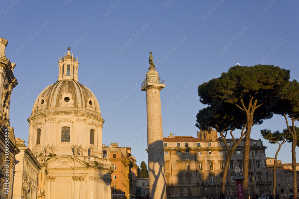 Day view of the Trajan column and the Santa Maria di Loreto Church in Rome, Italy