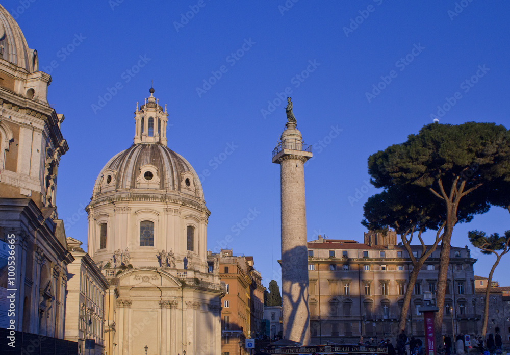 Day view of the Trajan column and the Santa Maria di Loreto Church in Rome, Italy