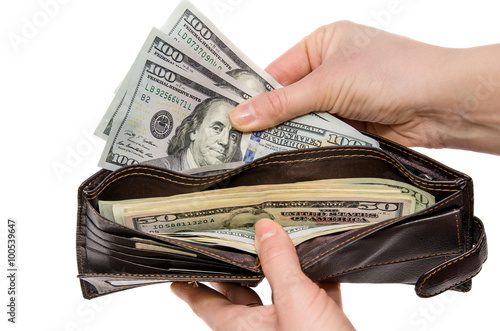 wallet with dollars in the woman hands isolated