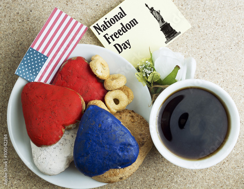 Heart shaped cookies color red, blue, white. Cup of coffee (tea) National Freedom Day