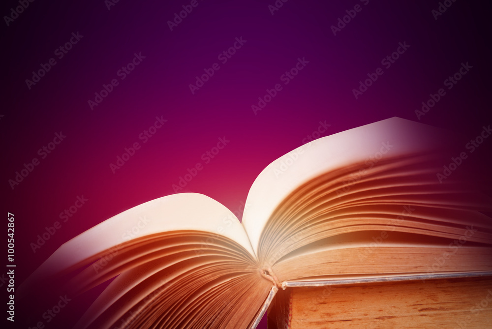 Abstract purple magic book on wooden background Abstract purple magic book on wooden background