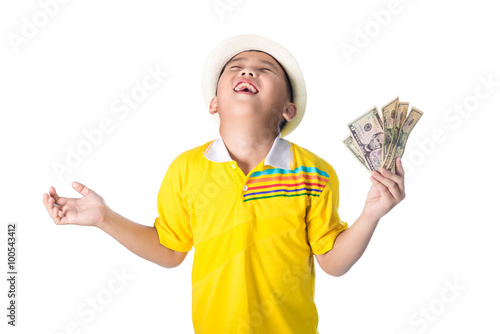 Asian child holding money while standing isolated on white backg
