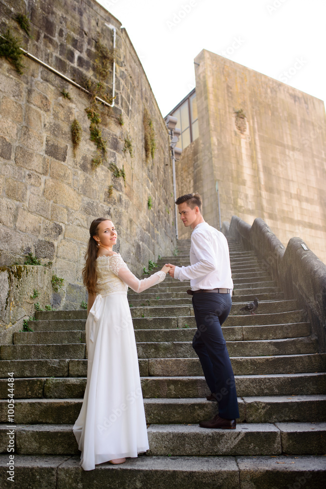 beautiful bride and groom on the stairs beautiful bride and groom on the stairs