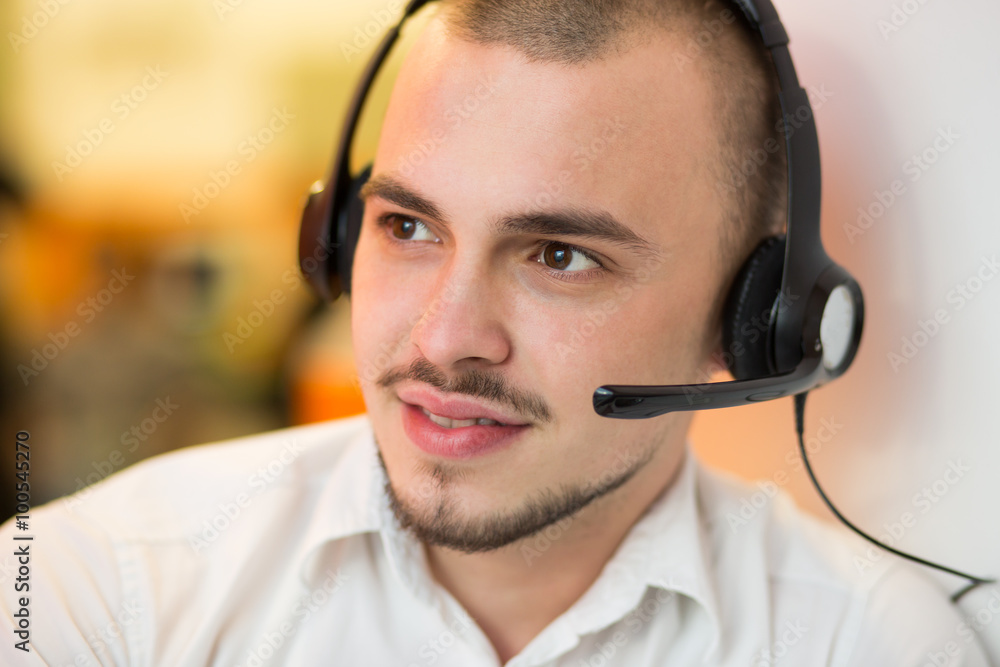 Portrait of happy smiling customer support phone operator in hea Portrait of happy smiling customer support phone operator in hea