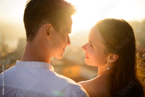 happy young couple and the bright rays of light