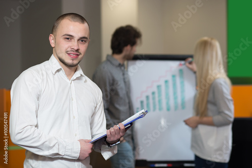 Portrait of young confident men employee dressed in casual cloth