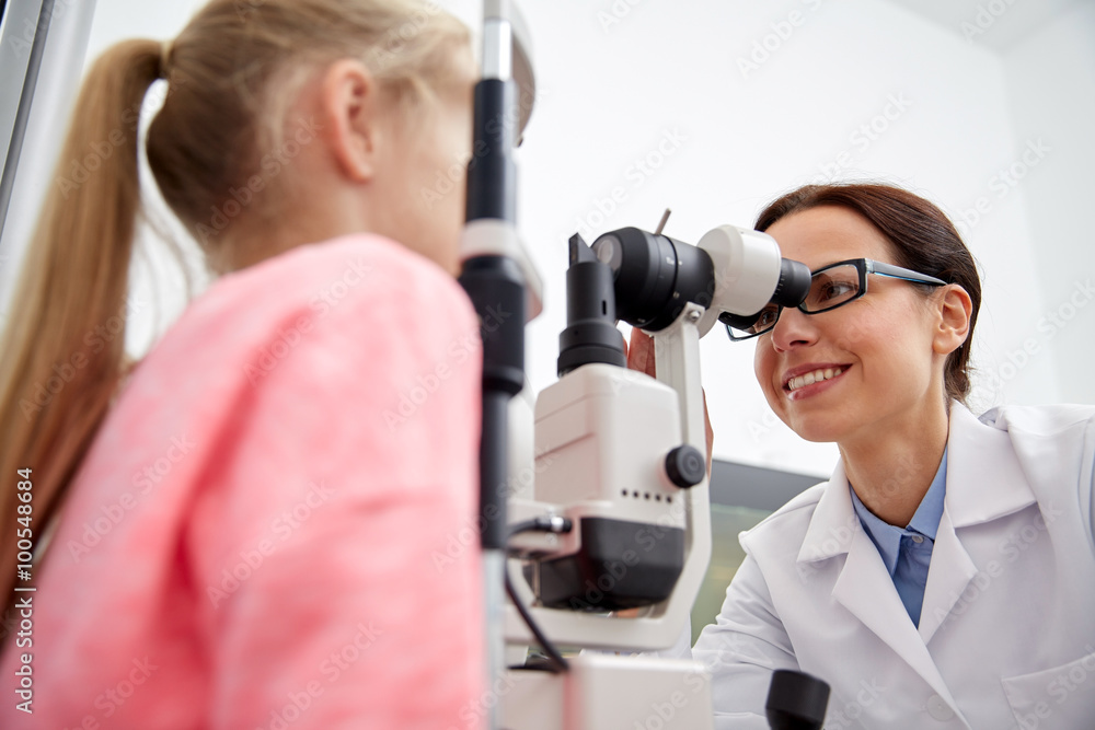 optician with tonometer and patient at eye clinic optician with tonometer and patient at eye clinic
