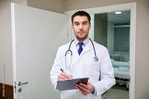 doctor with stethoscope and clipboard at hospital