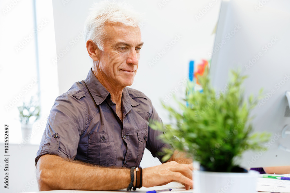Handsome businessman in office Handsome businessman in office
