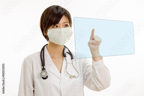 Asian female doctor pressing virtual screen