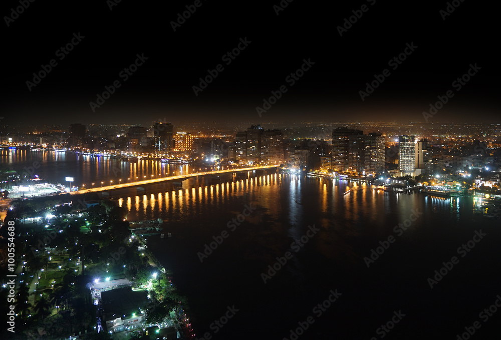 Fototapeta premium Aerial view of Nile river and bridge Cairo Egypt at night