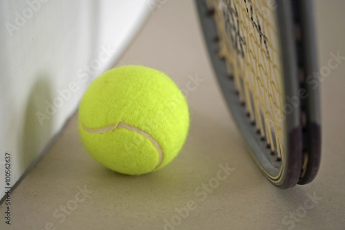 Tennis ball with racket / Tennis ball with racket on the ground.