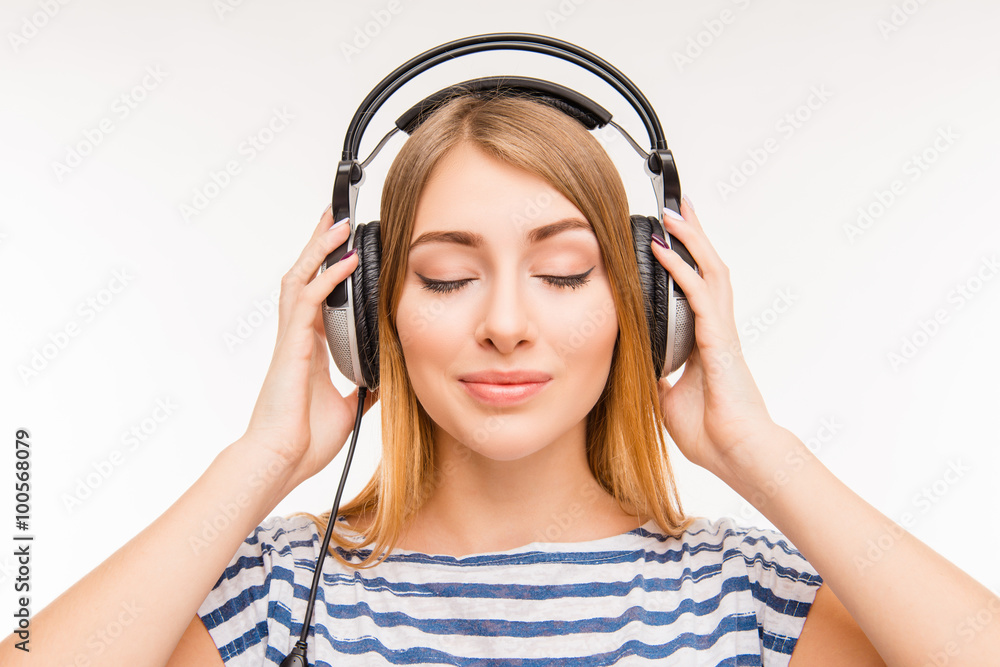 Calm relaxed young woman with headphones and closed eyes Calm relaxed young woman with headphones and closed eyes