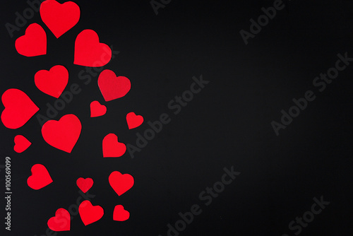 Red heart paper cut on black background
