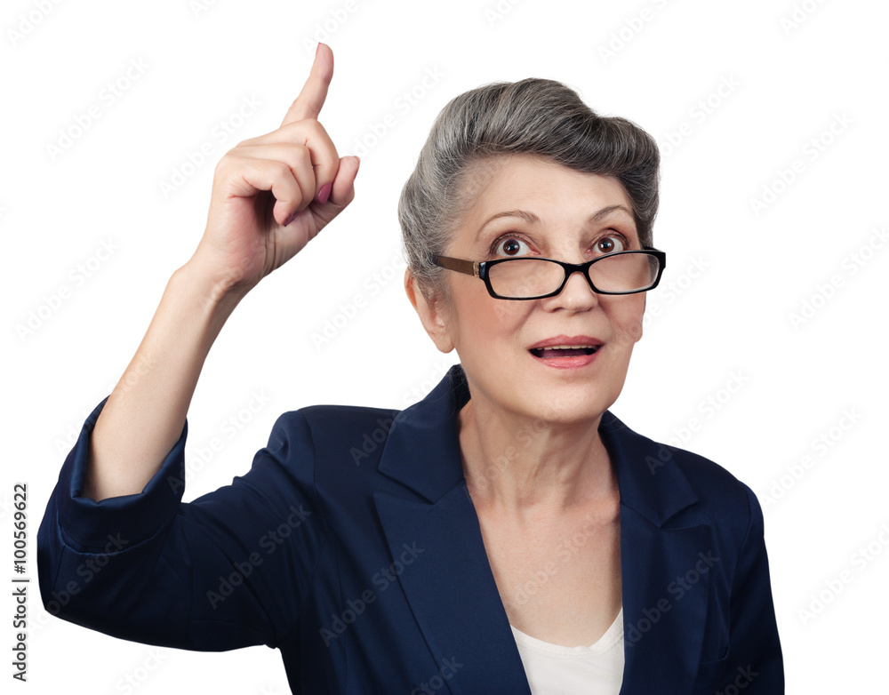 Happy aged woman pointing her finger upwards Happy aged woman pointing her finger upwards
