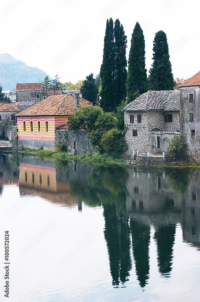 Reflected house in the river Trebisnjica