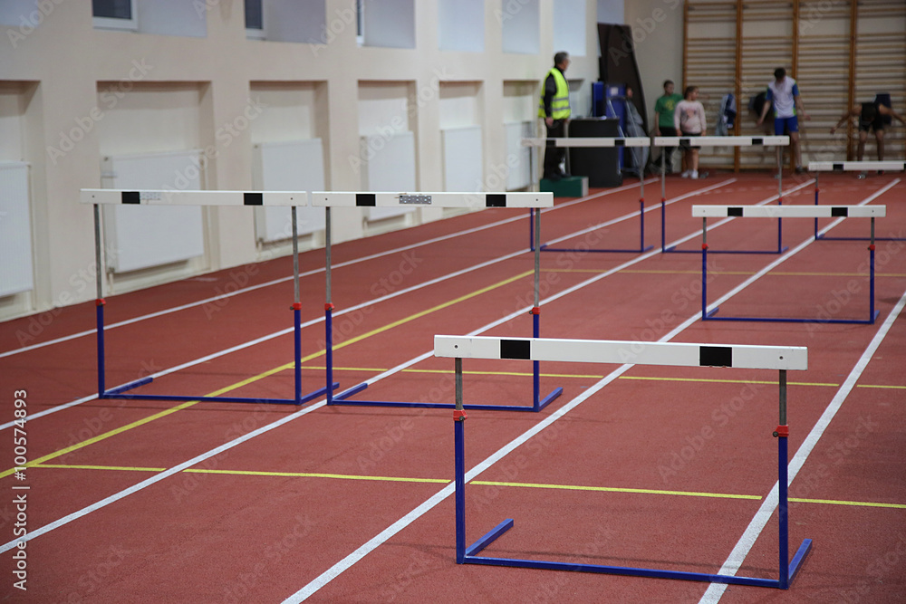 Barriers over a running track