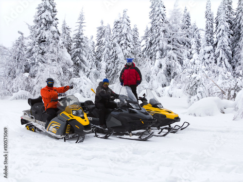 Athletes on a snowmobile
