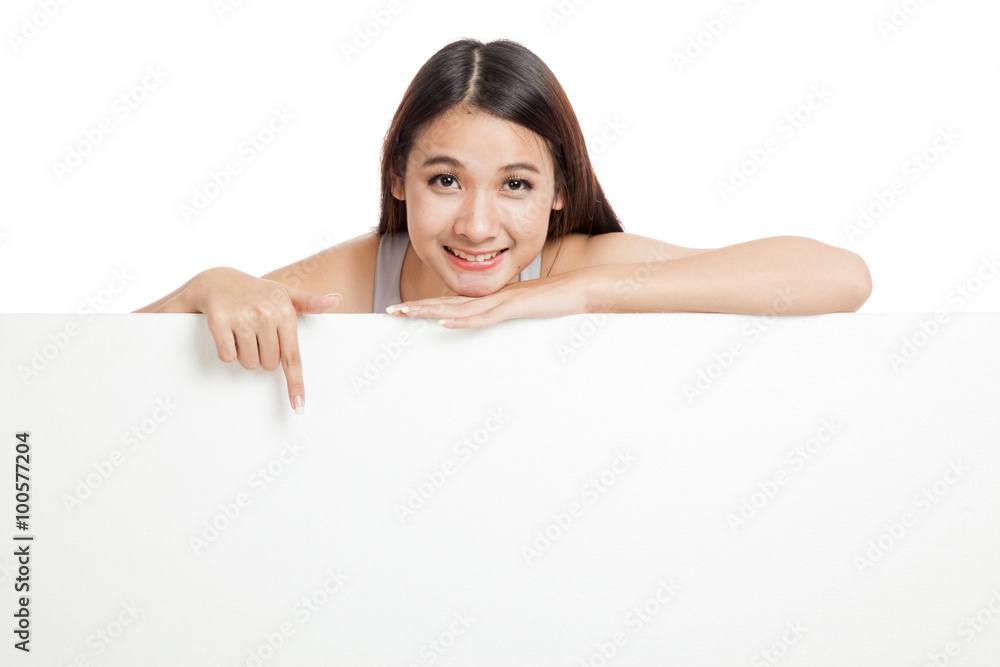 Young Asian woman point down behind a blank sign Young Asian woman point down behind a blank sign