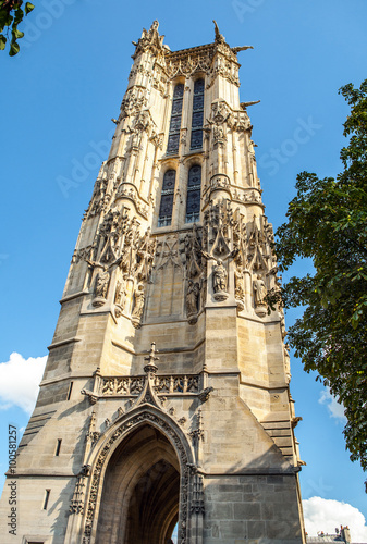 PARIS, FRANCE - AUGUST 30, 2015: Saint-Jacques Tower located on Rivoli street. This 52m Flamboyant Gothic tower is all that remains of former 16 century Church of Saint-Jacques-de-la-Boucherie. Paris. photo