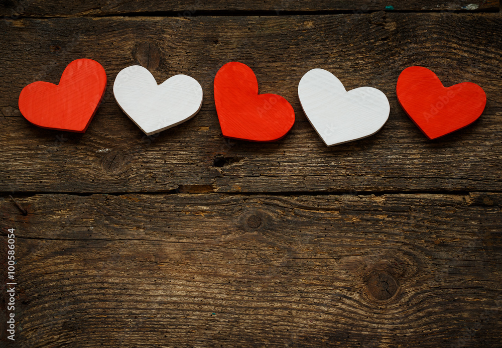 Red and white hearts on old shabby wooden background Red and white hearts on old shabby wooden background