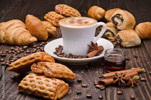 Wallpaper Mural Cup of Coffee with Pastry on brown wood table background Torontodigital.ca