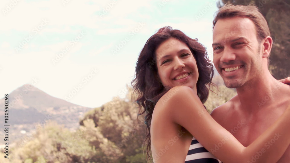Smiling woman giving kiss to husband Smiling woman giving kiss to husband