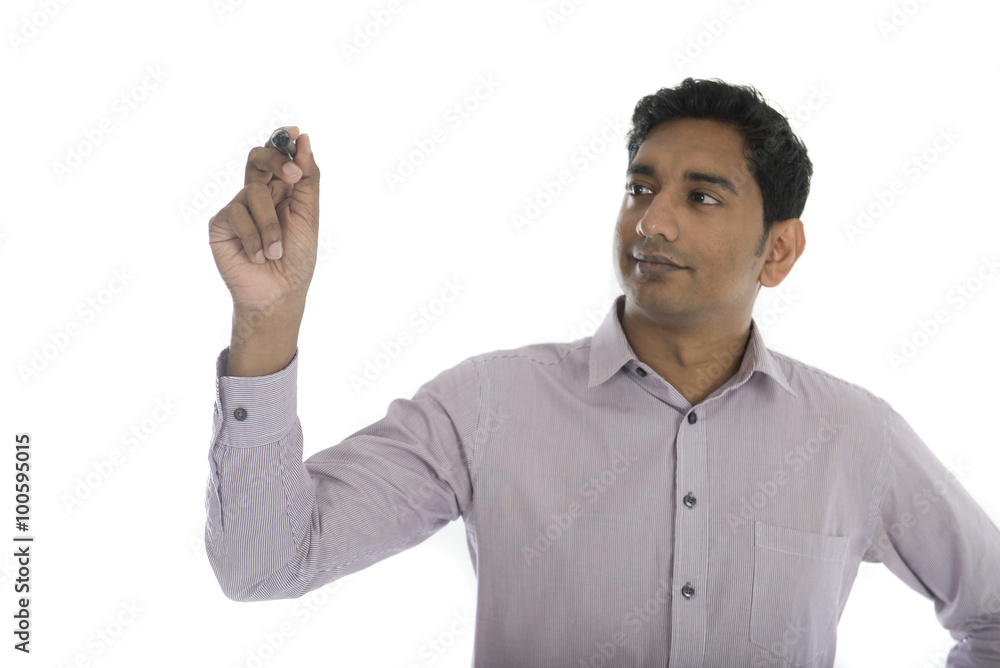 Asian Indian businessman in black suit writing something on glas Asian Indian businessman in black suit writing something on glas