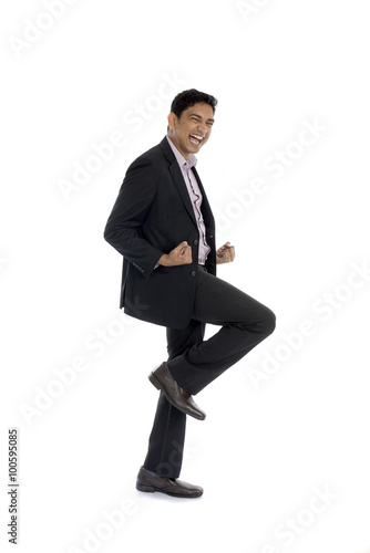 indian business male jumping in joy