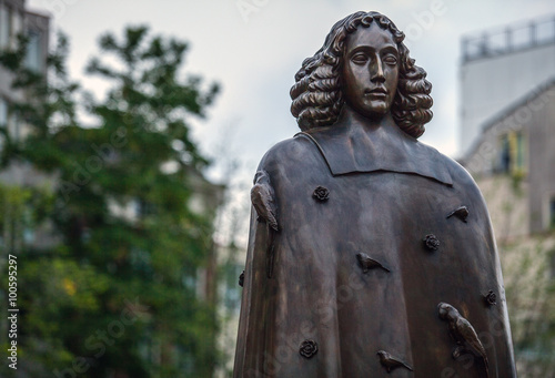 AMSTERDAM, NETHERLANDS - AUGUST 22: City sculpture from bronze of Spinoza on August 22, 2015 in Amsterdam. photo
