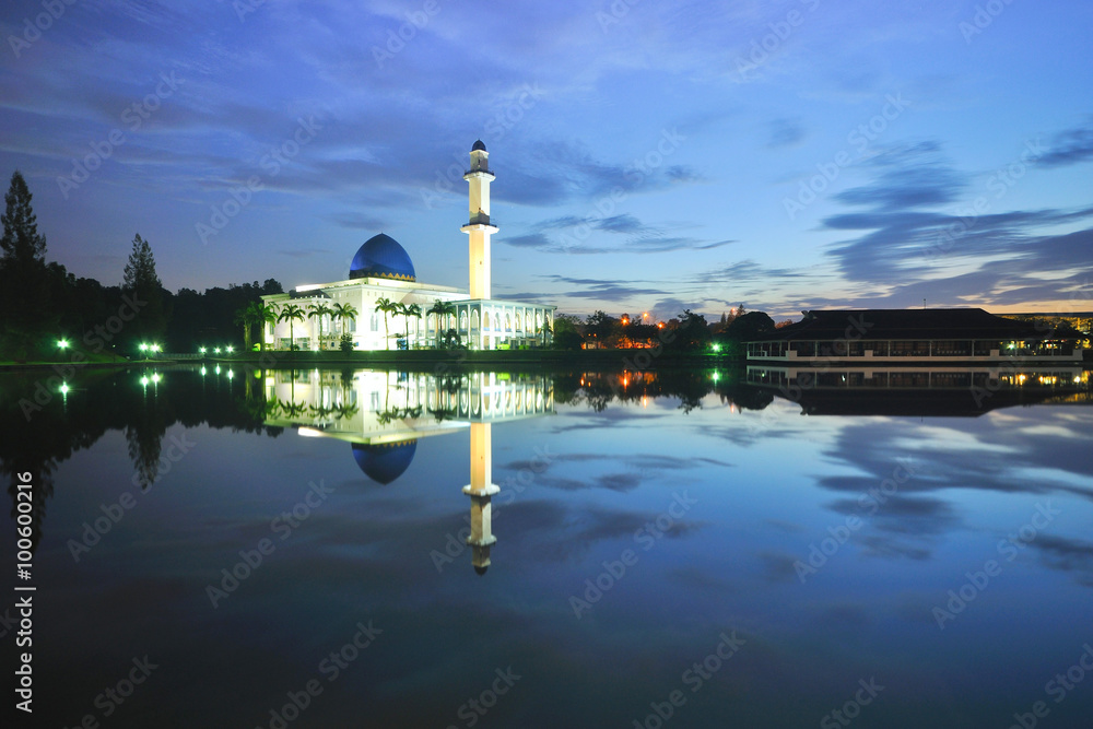 Beautiful white floating mosque during blue hour.