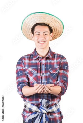 Smiling farmer holding something on palm of hands, smiling male farmer isolated on white with clipping path.