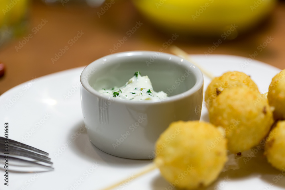 Cheese balls on wooden skewers