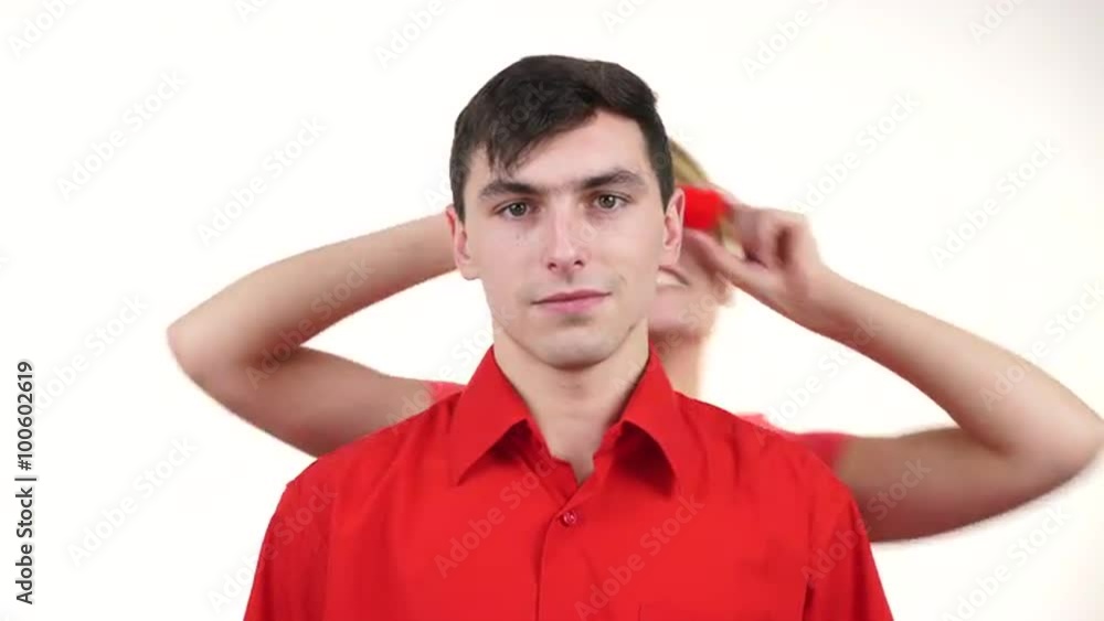 Couple. Serious man and crazy woman holds red hearts over eyes 4K Couple. Serious man and crazy woman holds red hearts over eyes 4K
