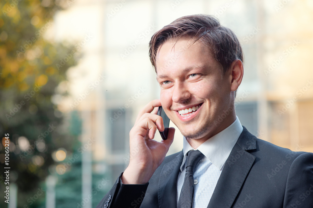 Businessman talking on the mobile phone Businessman talking on the mobile phone