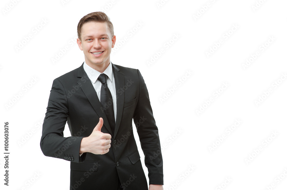 young man in formalwear showing his thumb up young man in formalwear showing his thumb up