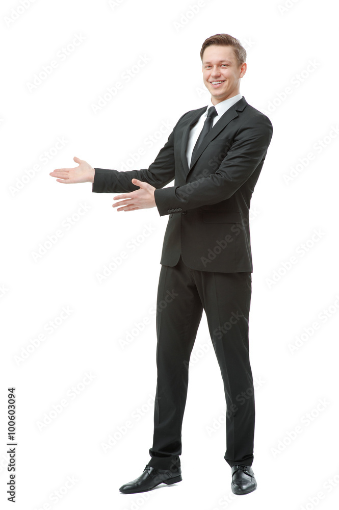 young man in formalwear poining copy space young man in formalwear poining copy space
