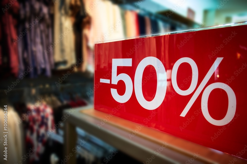 clothing store sales/clothing store discount sale with a fifty percent off price tag