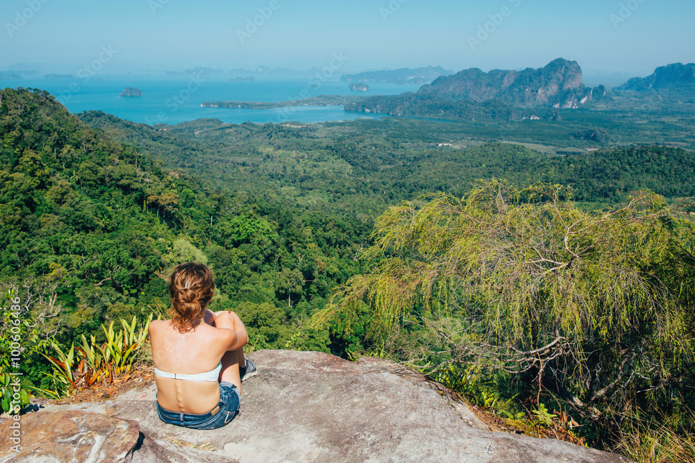 Girl sitting on the view point of the mountain.  Krabi, Thailand