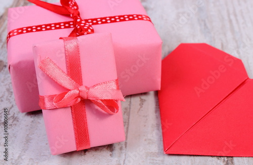 Wrapped gifts for birthday, valentine or other celebration and red heart