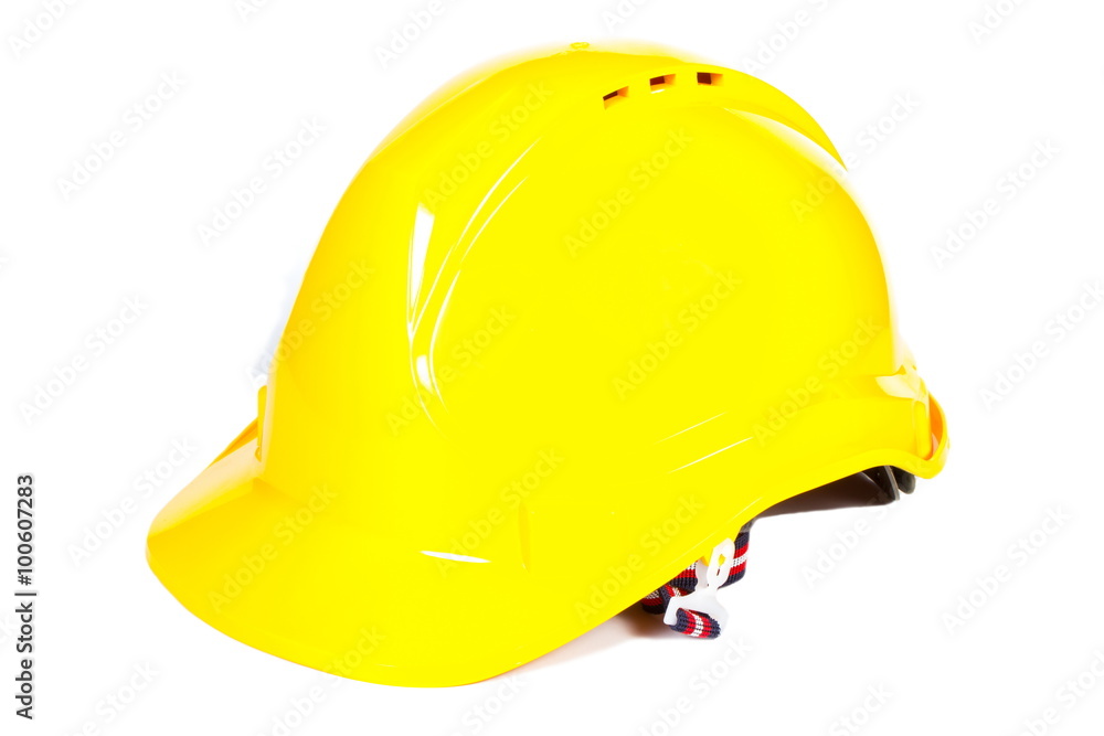 Fototapeta premium Closeup of yellow protective helmet on white background