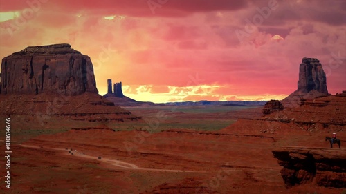 Monument Valley with Background Red Clouds in Time lapse photo
