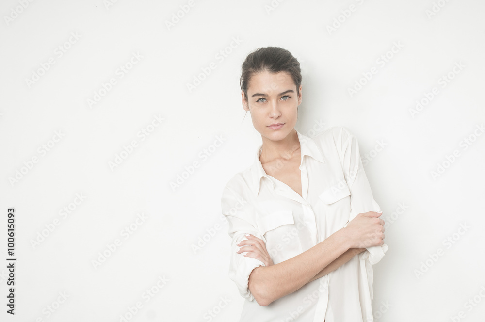 Beuatiful caucasian young woman with her arms on her chest Beuatiful caucasian young woman with her arms on her chest