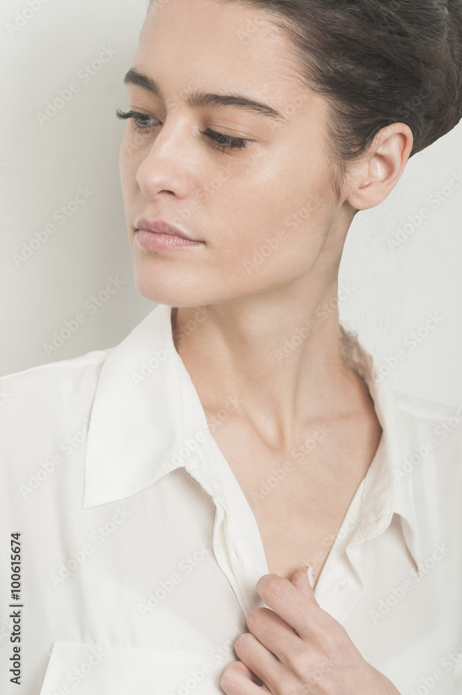 Beautiful young woman close up portrait on grey beckground Beautiful young woman close up portrait on grey beckground