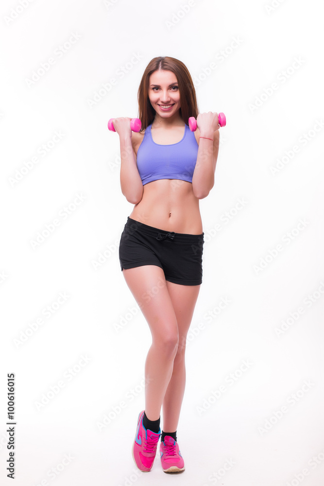 Active sportive athletic woman with dumbbells pumping up muscles biceps concept fitness sport training lifestyle Active sportive athletic woman with dumbbells pumping up muscles biceps concept fitness sport training lifestyle