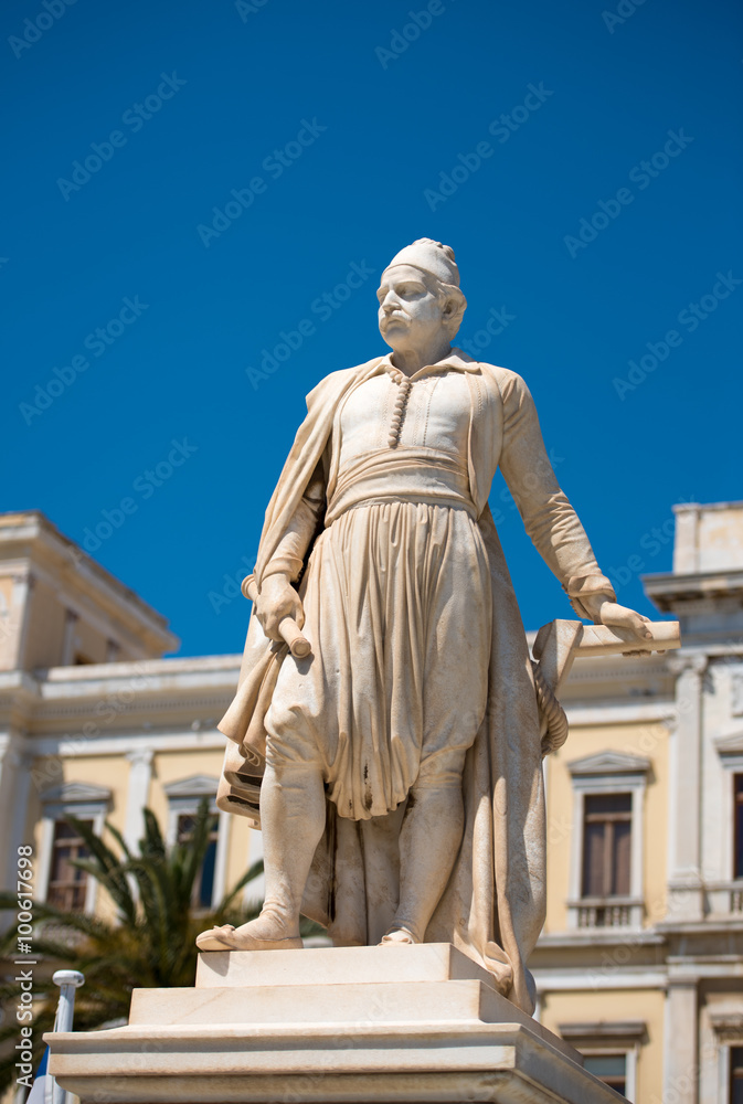 Fototapeta premium Statue of greek hero, Andreas Miaoulis, in front of the Town Hall of Ermoupolis, in Syros island, Aegean, Greece.