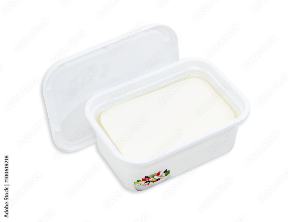 Container of feta cheese with the cover removed Container of feta cheese with the cover removed
