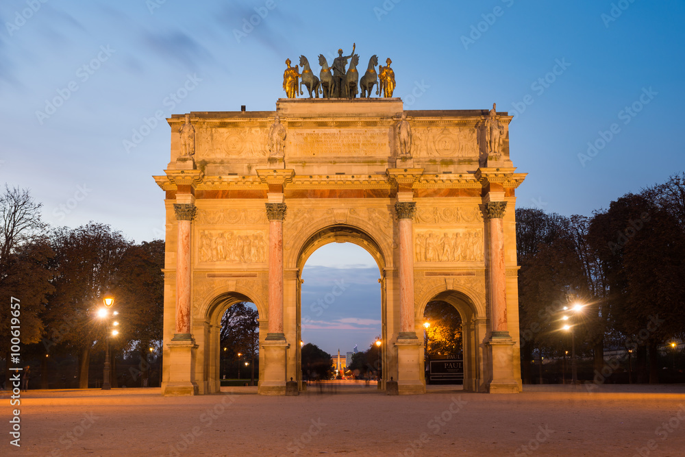 Evening view of Arc de Triomphe du Carrousel on Place du Carrousel at the famous Museum Louvre